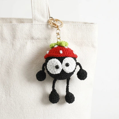 Gehäkelter „Black Coal Ball“ Taschenanhänger